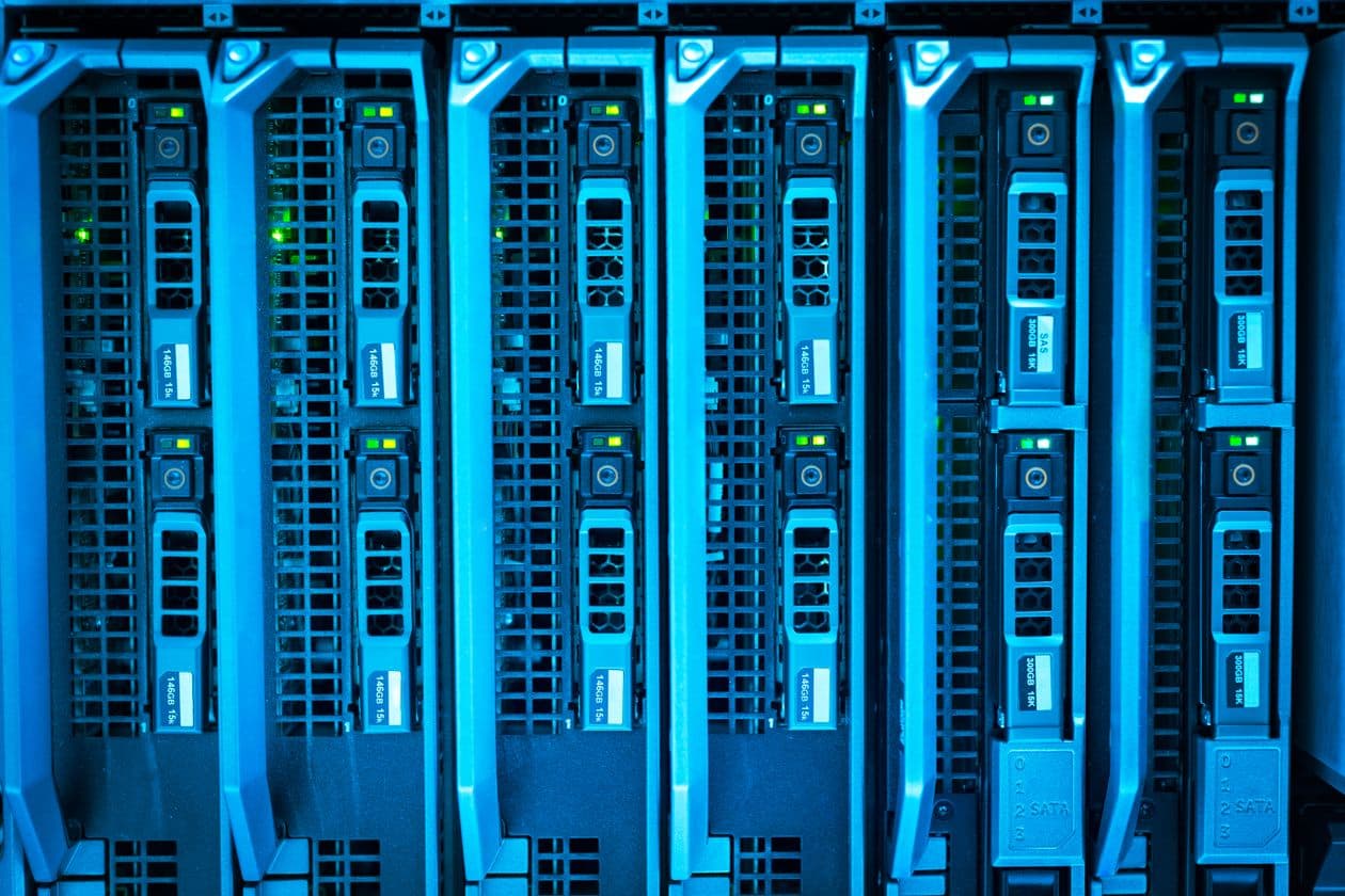 Rows of illuminated server racks in a data center