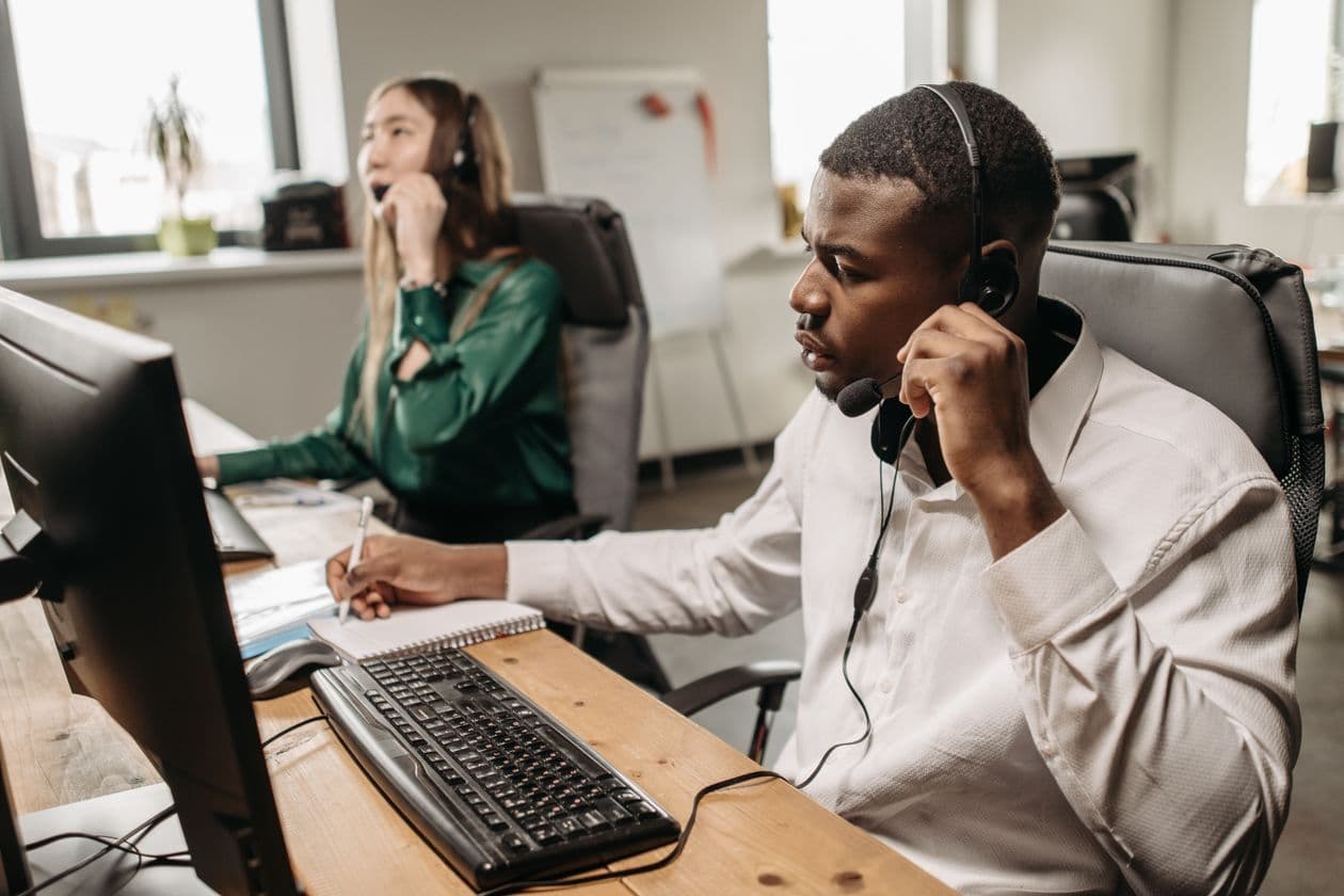 Customer service team on calls at their computers