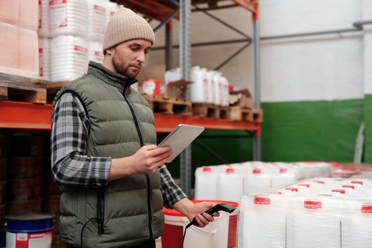 Warehouse worker checking stock on a tablet