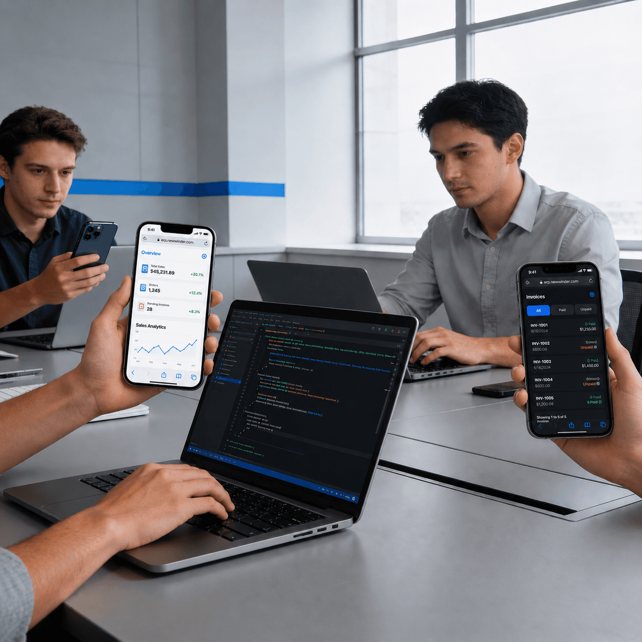 People using a mobile app on phones beside a laptop